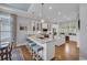 Elegant kitchen featuring granite countertops, stainless steel appliances, and center island with breakfast bar at 179 Cottage Ct., Pawleys Island, SC 29585