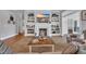 Cozy living room with fireplace, built-in shelves, and comfortable seating for relaxing and entertaining guests at 179 Cottage Ct., Pawleys Island, SC 29585