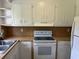 A kitchen with white cabinets, wood countertops, and appliances at 189 Lewis Rd., Hemingway, SC 29554