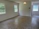 Bright living room featuring neutral walls, tile flooring, and plenty of natural light from multiple windows at 189 Lewis Rd., Hemingway, SC 29554