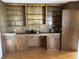 Office area with built-in cabinets and wooden paneled walls at 189 Lewis Rd., Hemingway, SC 29554