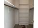 Bright walk-in closet offers ample storage with shelving and hanging space, ready for organization at 189 Lewis Rd., Hemingway, SC 29554