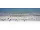 Expansive ocean view featuring a sandy beach with colorful umbrellas and gentle waves at 2000 N Ocean Blvd. # 1810, Myrtle Beach, SC 29577