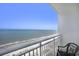 Bright balcony view with ocean view and seating to enjoy the peaceful outdoors at 2000 N Ocean Blvd. # 1810, Myrtle Beach, SC 29577