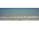 Scenic ocean view with gentle waves meeting a sandy beach, showcasing the peaceful coastal environment at 2000 N Ocean Blvd. # 1810, Myrtle Beach, SC 29577