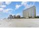Beach view showcasing sandy shoreline, ocean, skyline, and resort architecture at 2000 N Ocean Blvd. # 1810, Myrtle Beach, SC 29577