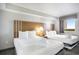 Cozy bedroom featuring two beds, night stand and natural light from the window at 2000 N Ocean Blvd. # 1810, Myrtle Beach, SC 29577