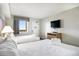 Well appointed bedroom with two beds, closet and natural light from the window at 2000 N Ocean Blvd. # 1810, Myrtle Beach, SC 29577