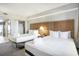 Comfortable bedroom featuring two beds, closet and natural light from the door to the balcony at 2000 N Ocean Blvd. # 1810, Myrtle Beach, SC 29577
