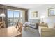 Cozy living room with balcony access offering outdoor seating with an ocean view at 2000 N Ocean Blvd. # 1810, Myrtle Beach, SC 29577