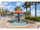 Gathering-friendly splash pad featuring a crown-topped fountain amidst lush tropical landscaping at 2000 N Ocean Blvd. # 1810, Myrtle Beach, SC 29577