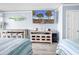 Well-equipped bedroom with a large TV, desk, and mini-fridge perfect for vacation rentals at 201 74Th Ave. N # 2534, Myrtle Beach, SC 29572