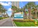 Sand Dunes Resort sign with palm trees and yellow flowers at 201 74Th Ave. N # 2534, Myrtle Beach, SC 29572