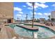 Scenic pool with lazy river, palm trees, and lounge chairs at 201 74Th Ave. N # 2534, Myrtle Beach, SC 29572