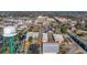 Aerial view of a coastal town featuring buildings, water tower, roads, and lush green trees at 203 Old Hickory Dr., Conway, SC 29526