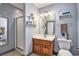Bathroom featuring walk in shower, wooden vanity, and simple decor at 203 Old Hickory Dr., Conway, SC 29526