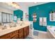 Bright bathroom featuring a double vanity, large mirror, soaking tub, and stylish decor at 203 Old Hickory Dr., Conway, SC 29526