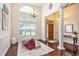 Elegant room showcasing high ceilings, a statement window, hardwood floors, and decorative touches at 203 Old Hickory Dr., Conway, SC 29526