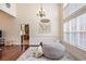 Bright living room with hardwood floors, high ceilings, and large windows offering ample natural light at 203 Old Hickory Dr., Conway, SC 29526