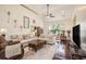 Bright living room with high ceilings, hardwood floors, comfortable seating, and large windows for natural light at 203 Old Hickory Dr., Conway, SC 29526
