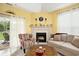 Inviting living room featuring a fireplace, comfortable seating, natural light, and an open layout, great for entertaining at 203 Old Hickory Dr., Conway, SC 29526