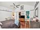 Comfortable main bedroom featuring hardwood floors, large closet, and access to a private bathroom at 203 Old Hickory Dr., Conway, SC 29526