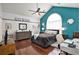 Spacious main bedroom with a fan, high ceilings, hardwood floors, and modern decor at 203 Old Hickory Dr., Conway, SC 29526