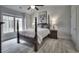 Bedroom with a four-poster bed, side table, large window and light gray flooring at 2180 Waterview Dr. # 738, North Myrtle Beach, SC 29582