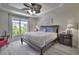 Bedroom features a ceiling fan, a large window with lots of natural light and a comfortable queen-size bed at 2180 Waterview Dr. # 738, North Myrtle Beach, SC 29582