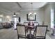 Stylish dining room with wood table, decorative chandelier, and an open floor plan at 2180 Waterview Dr. # 738, North Myrtle Beach, SC 29582