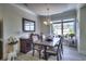 Bright dining room with an elegant chandelier and an eye catching view of the building exterior through a large window at 2180 Waterview Dr. # 738, North Myrtle Beach, SC 29582