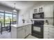 Charming kitchen with white cabinets and modern appliances, complemented by an eat-in kitchen area at 2180 Waterview Dr. # 738, North Myrtle Beach, SC 29582