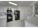 Bright kitchen with white cabinetry, quartz countertops, and stainless-steel appliances at 2180 Waterview Dr. # 738, North Myrtle Beach, SC 29582