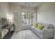 Cozy living room featuring a comfortable sofa, bright window, and stylish decor at 2180 Waterview Dr. # 738, North Myrtle Beach, SC 29582