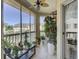 Relaxing porch with fan, potted plants, and a peaceful view of the community at 2180 Waterview Dr. # 738, North Myrtle Beach, SC 29582