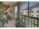 Screened-in porch featuring beautiful plants, comfortable seating, and calming views at 2180 Waterview Dr. # 738, North Myrtle Beach, SC 29582