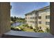 Balcony view featuring a serene lake with an attractive building in the background at 2180 Waterview Dr. # 738, North Myrtle Beach, SC 29582