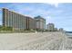 Expansive beachfront view with large resorts bordering the sandy shoreline at 2207 S Ocean Blvd. # 718, Myrtle Beach, SC 29577