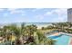 An inviting pool area with ocean views, lounge chairs, palm trees and beach access at 2207 S Ocean Blvd. # 718, Myrtle Beach, SC 29577