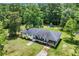 Charming single-story home featuring a covered porch and beautifully landscaped yard at 265 Powell Loop, Andrews, SC 29510