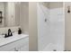 Bright bathroom featuring a modern white shower, vanity, and sleek black hardware at 265 Powell Loop, Andrews, SC 29510