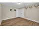 Spacious bedroom featuring hardwood flooring, base molding, and closet for storing at 265 Powell Loop, Andrews, SC 29510
