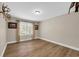 Neutral bedroom with hardwood floors, ample natural light, and classic decor at 265 Powell Loop, Andrews, SC 29510