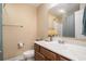 Powder room with single sink vanity, toilet, and decorative mirror for added convenience at 276 Avery Dr., Myrtle Beach, SC 29588