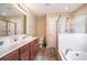 Bright bathroom with double vanity, separate shower, and soaking tub offers relaxation at 276 Avery Dr., Myrtle Beach, SC 29588