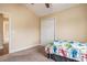 Comfortable bedroom with neutral tones, carpeted floors, and a closet with sliding doors at 276 Avery Dr., Myrtle Beach, SC 29588