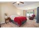 Comfortable bedroom with neutral tones, large window with recliner, and a ceiling fan at 276 Avery Dr., Myrtle Beach, SC 29588