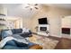 Inviting living room featuring hardwood floors, vaulted ceilings, a fireplace, and open floorplan at 276 Avery Dr., Myrtle Beach, SC 29588