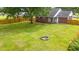 Aerial view of the spacious backyard featuring a large lawn and a wooden privacy fence at 2965 Mount Olive Rd., Loris, SC 29569