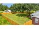 Aerial view of the backyard featuring a lawn, a fire pit and a wooden privacy fence at 2965 Mount Olive Rd., Loris, SC 29569